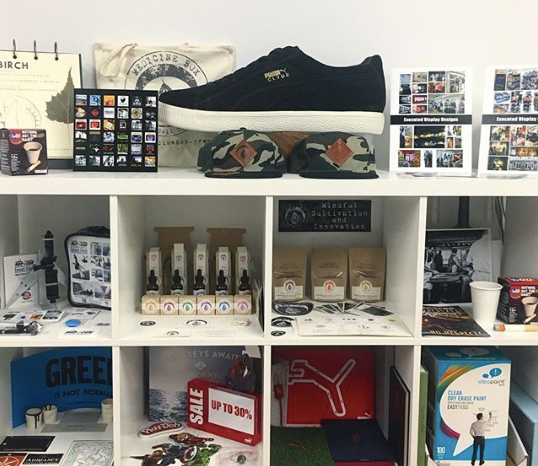 A studio display of many of Designer151’s projects, including marketing and branding materials for Hasbro, Puma, Alex And Ani, MarCam, Sperry, and many more!